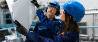 VTT-foam-forming-pilot.jpg Researchers working in VTT's foam forming pilot examining sheet of material